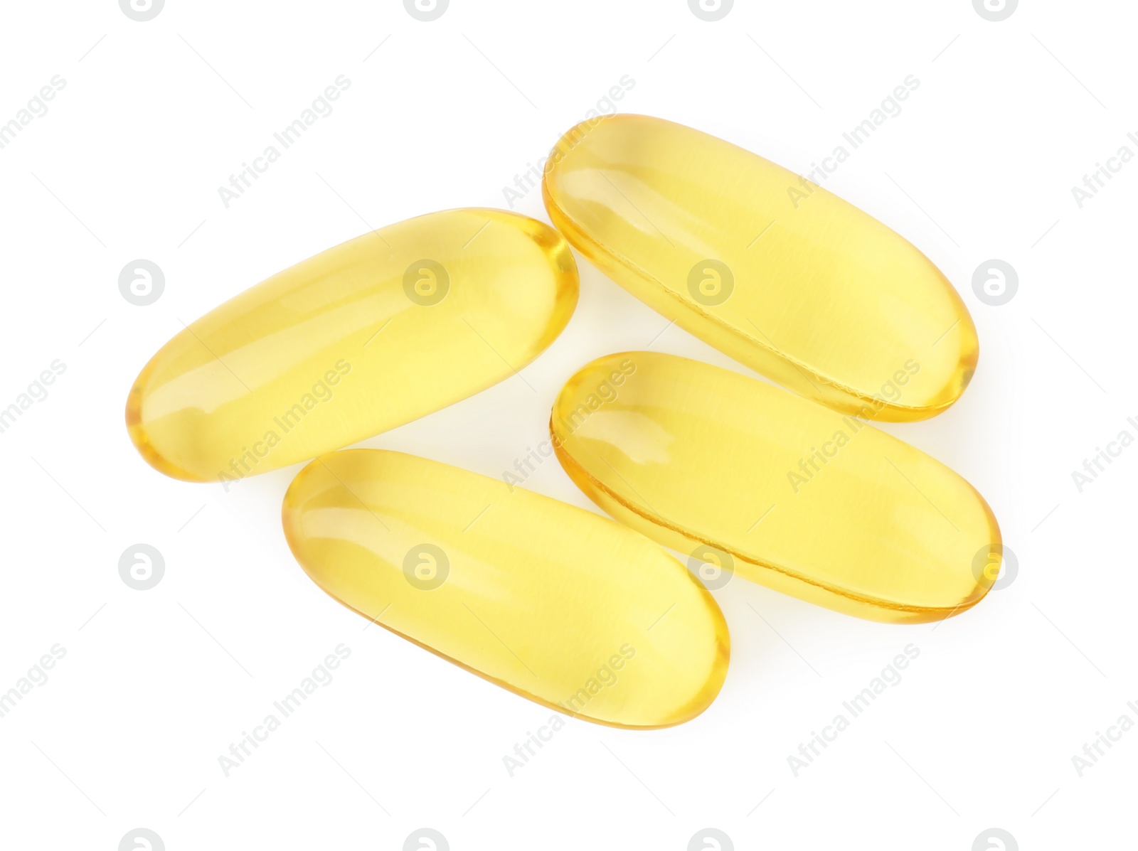 Photo of Many yellow vitamin capsules isolated on white, top view