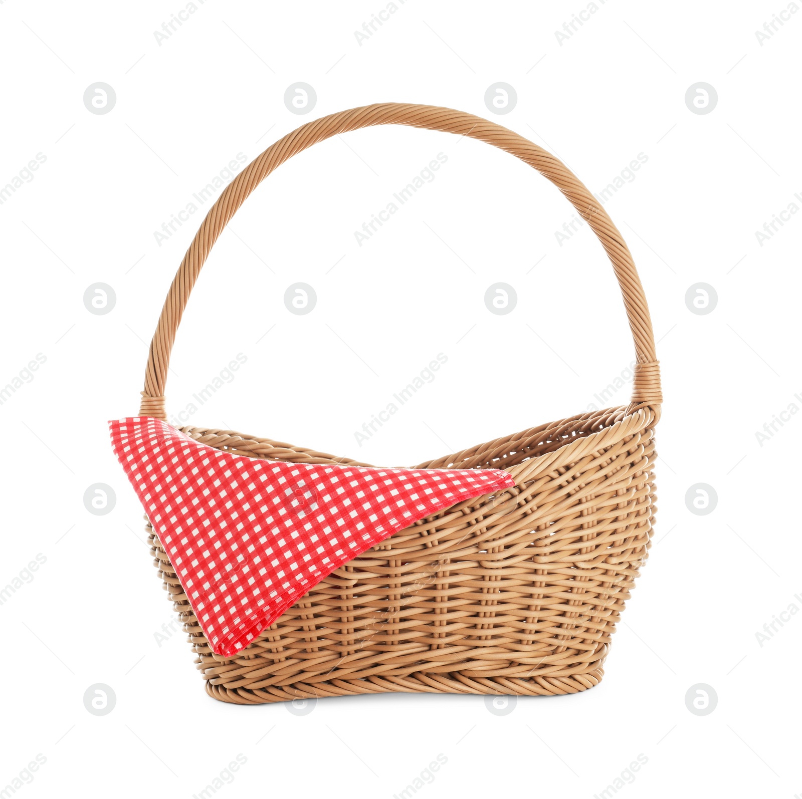 Photo of Wicker picnic basket with checkered tablecloth on white background