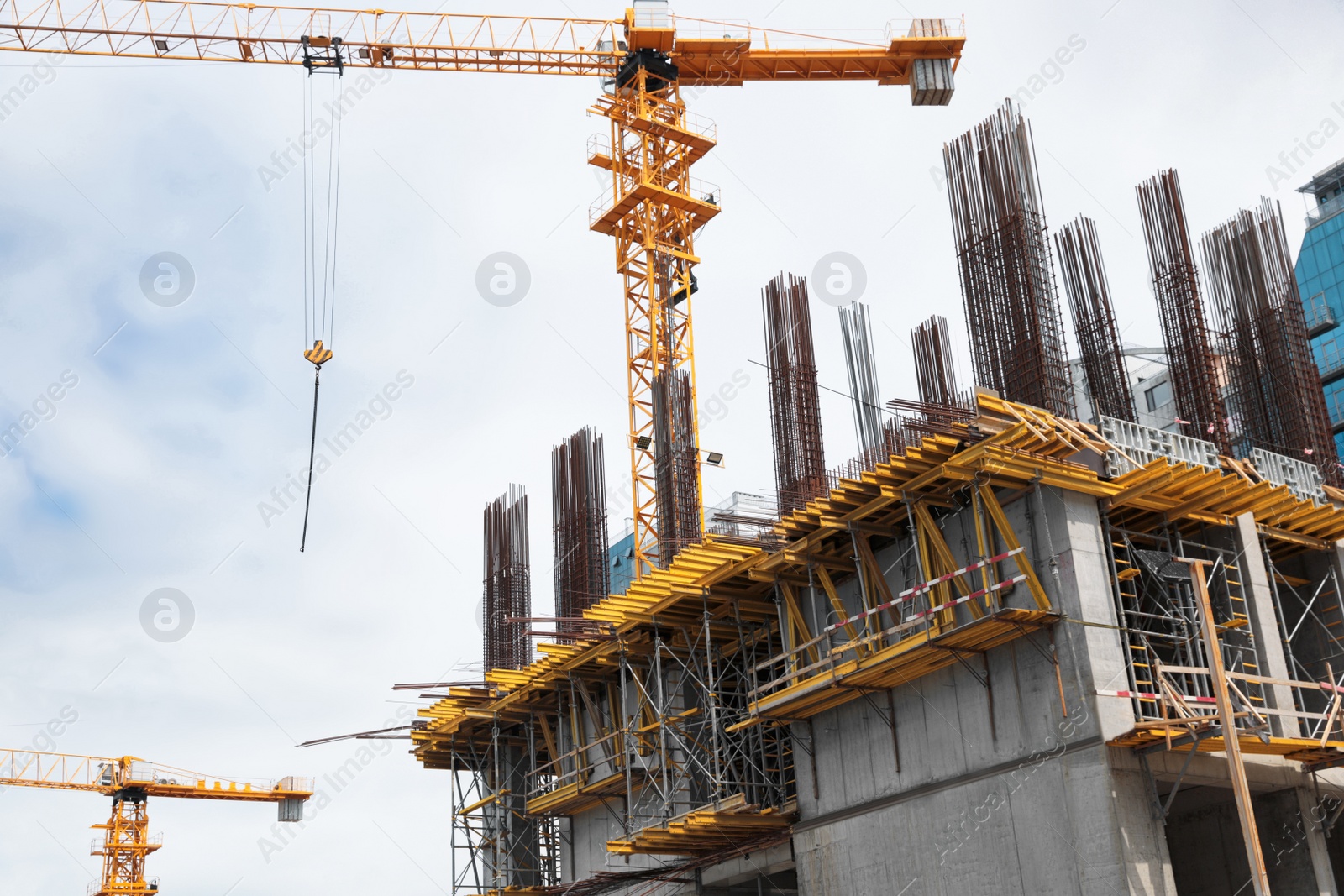 Photo of View of construction site with modern tower crane