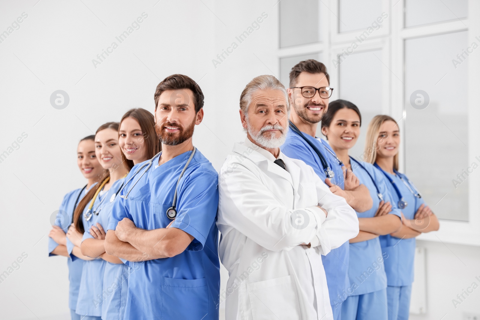 Photo of Doctor and his colleagues in hospital. Medical service