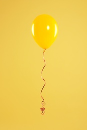 Bright balloon on color background. Celebration time