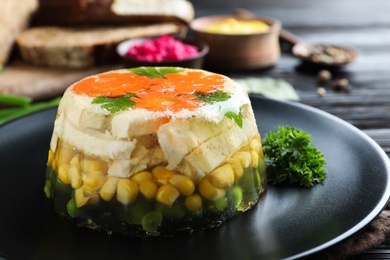 Photo of Delicious homemade chicken aspic on table, closeup