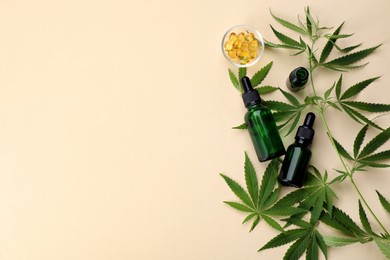 Photo of Flat lay composition with hemp leaves, CBD oil and THC tincture on beige background, space for text