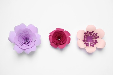 Different beautiful flowers made of paper on white background, top view