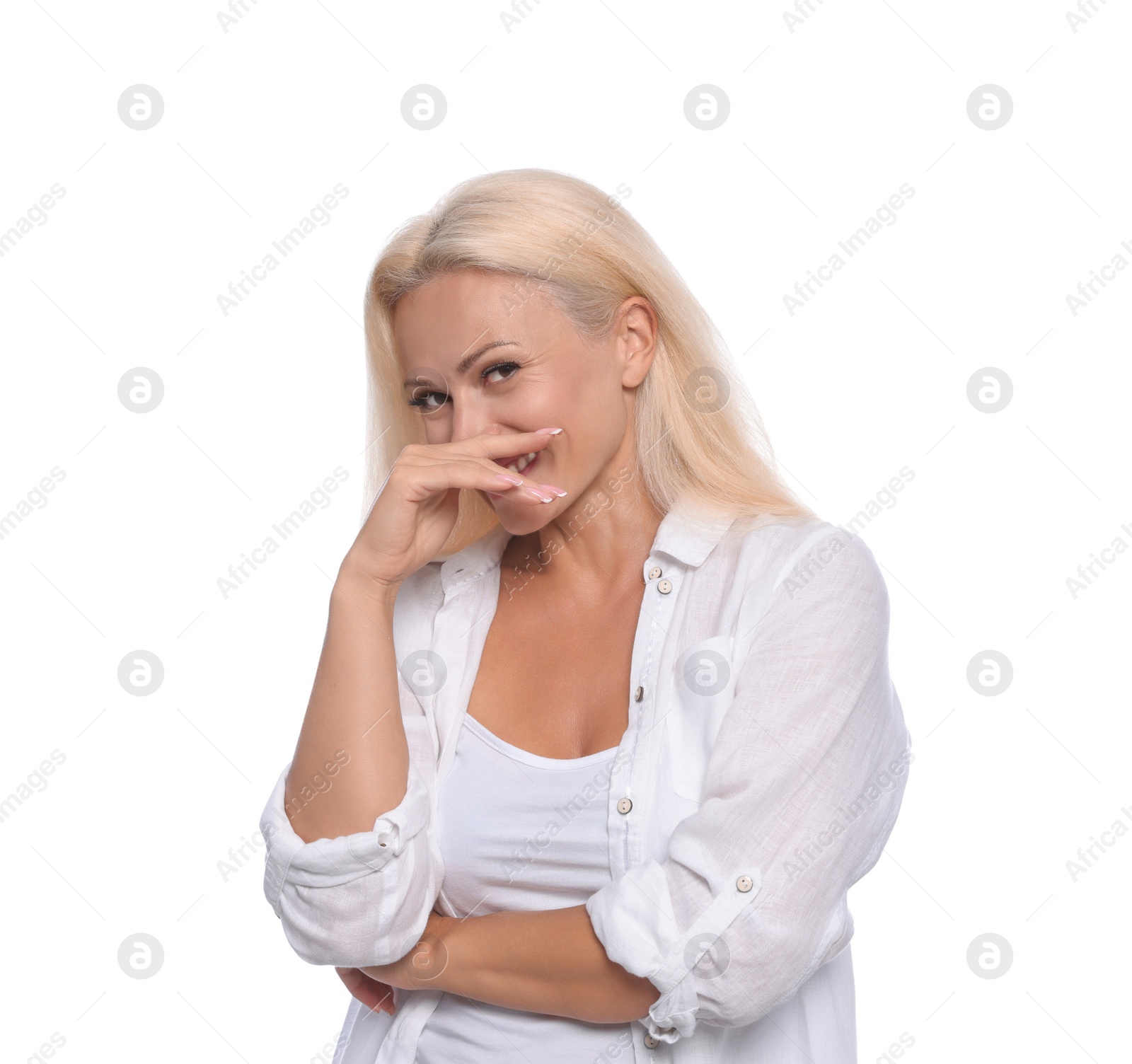Photo of Embarrassed woman covering her smile with hand on white background