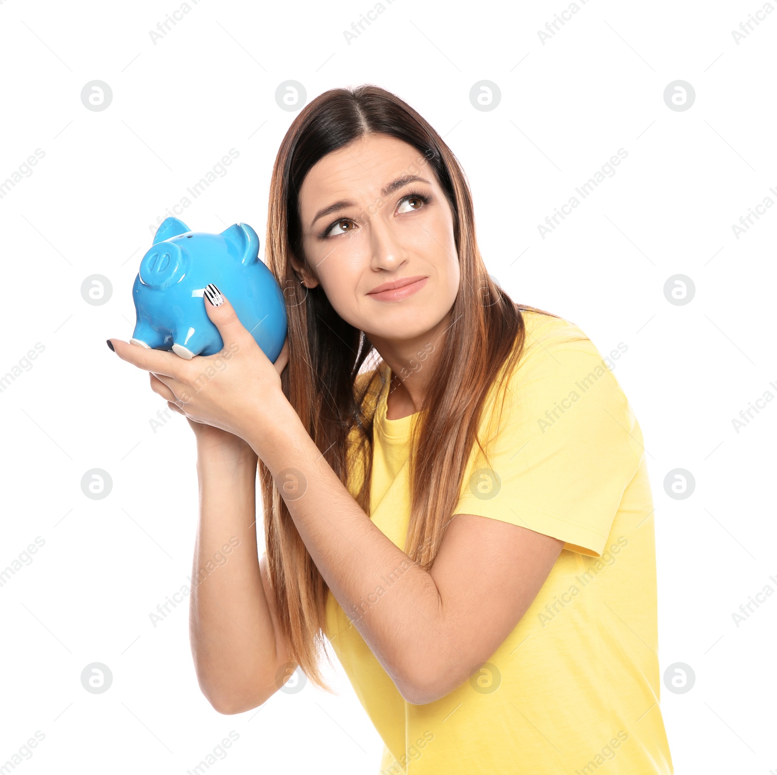 Photo of Young woman with piggy bank on white background