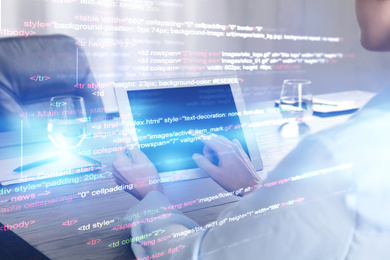 Image of Double exposure of female programmer using tablet and source code written in programming language, closeup 