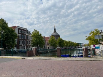 Photo of Leiden, Netherlands - August 28, 2022; Beautiful view of buildings and plants on city street