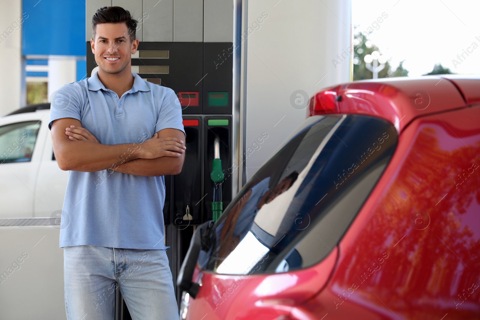 Photo of Man near car at self service gas station