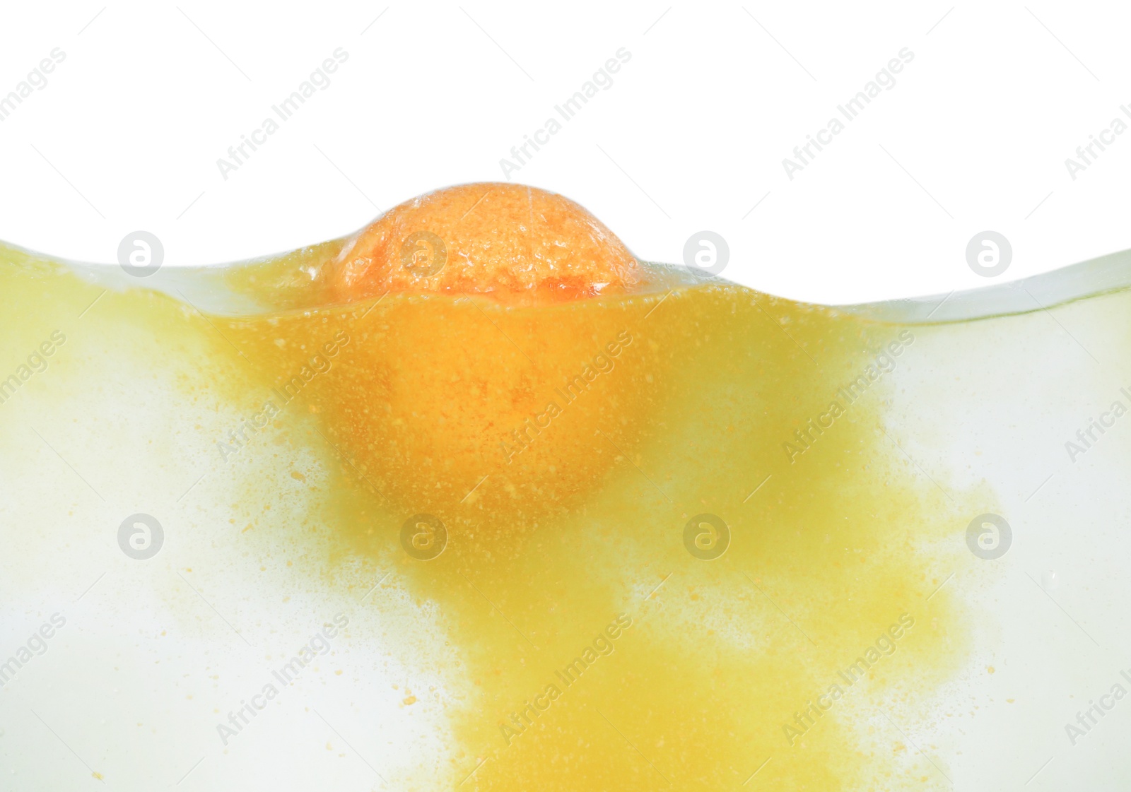 Photo of Bath bomb in water on white background