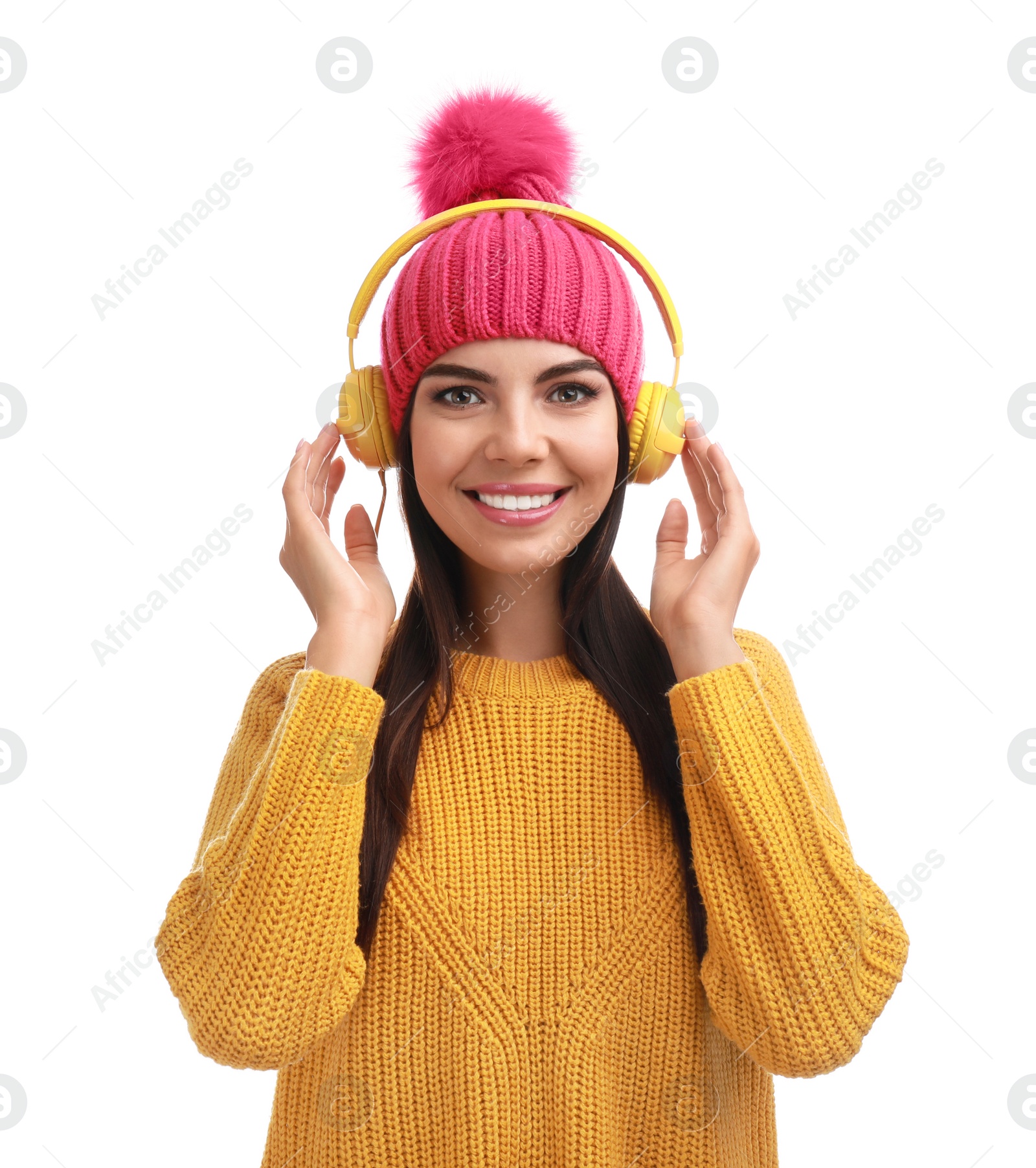 Photo of Young woman listening to music with headphones on white background