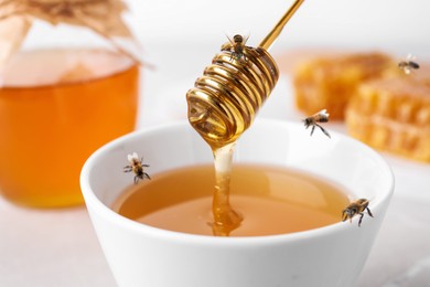 Image of Tasty honey and bees on table, closeup