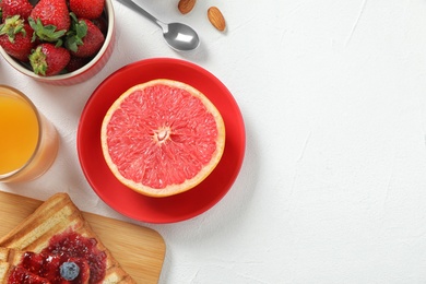 Delicious breakfast with served on white table, flat lay. Space for text