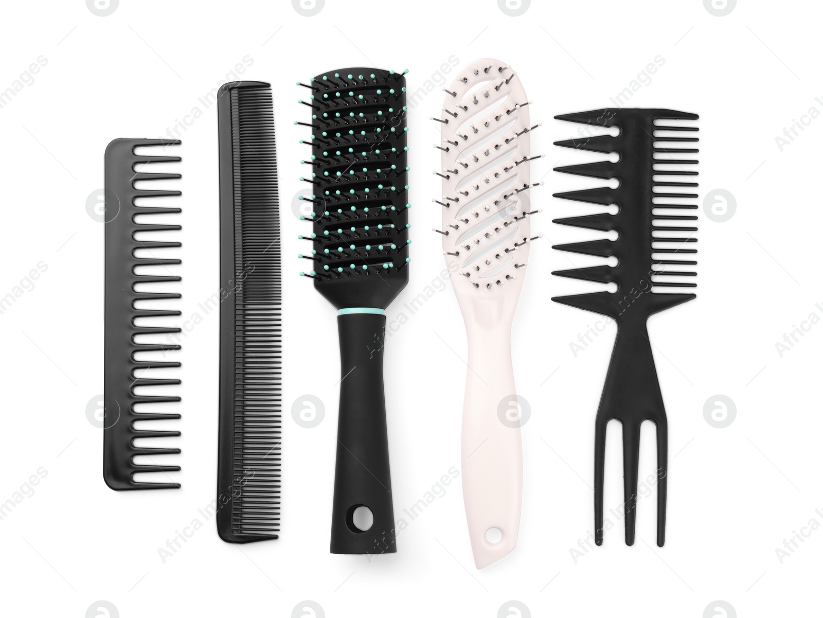 Photo of Set of hair brushes and combs isolated on white, top view