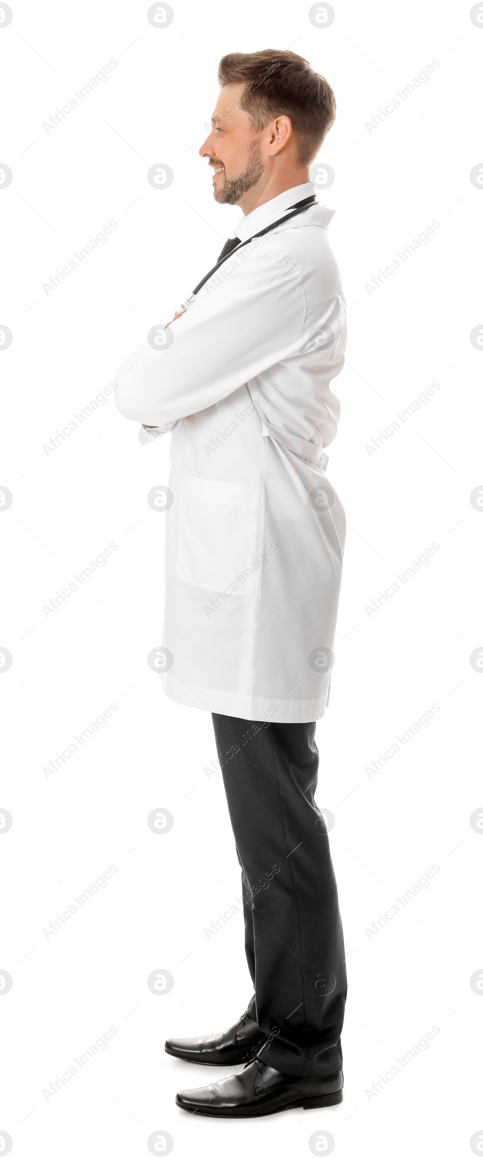 Photo of Full length portrait of smiling male doctor isolated on white. Medical staff