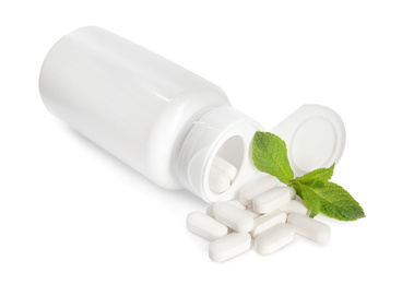 Bottle with vitamin pills and mint on white background