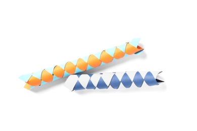 Photo of Chinese finger traps on white background, top view