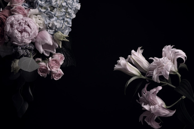 Beautiful bouquet of different flowers on black background, space for text. Floral card design with dark vintage effect