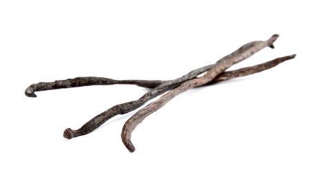 Photo of Dried aromatic vanilla sticks on white background