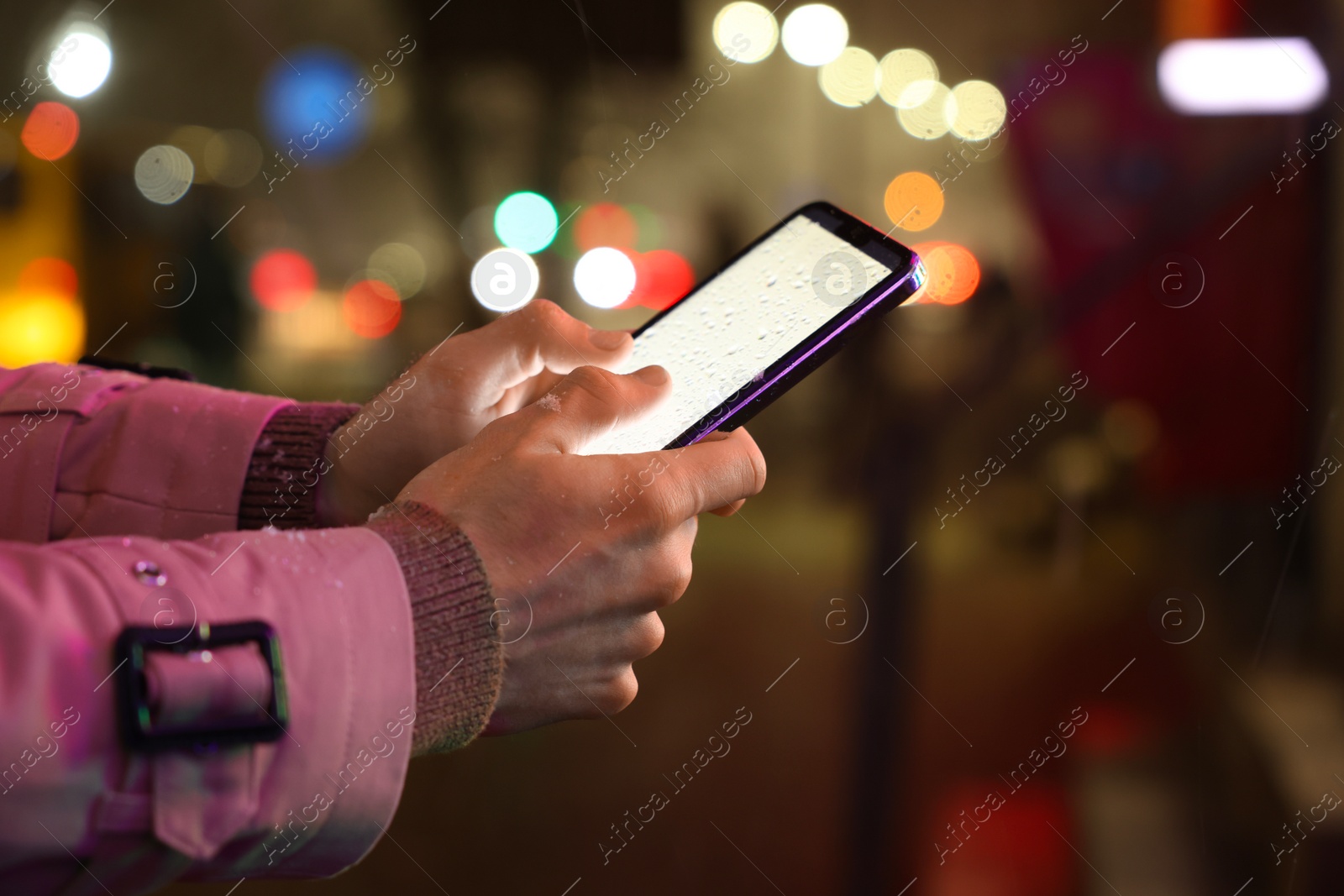 Photo of Man using smartphone on night city street, closeup. Space for text