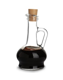 Photo of Glass jug with balsamic vinegar on white background