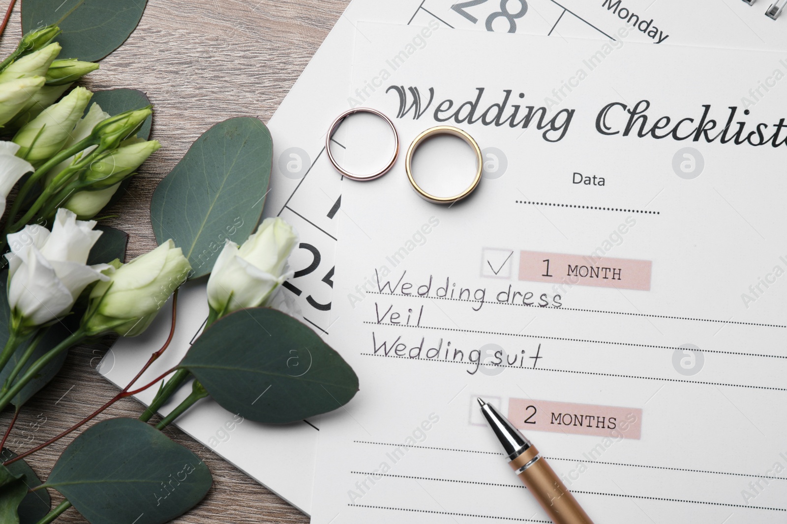 Photo of Flat lay composition with Wedding Checklist on wooden table