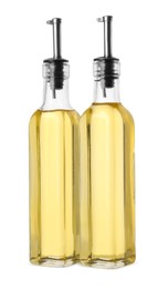 Photo of Glass bottles of cooking oil on white background