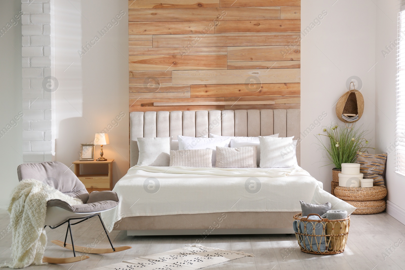 Photo of Stylish room interior with big comfortable bed