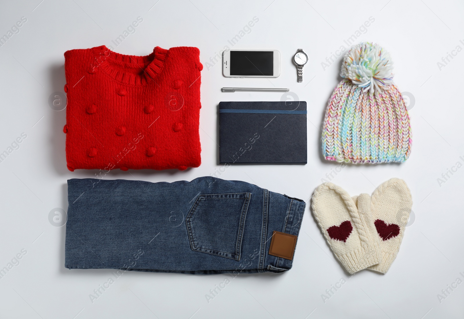 Photo of Flat lay composition with female winter clothes on white background