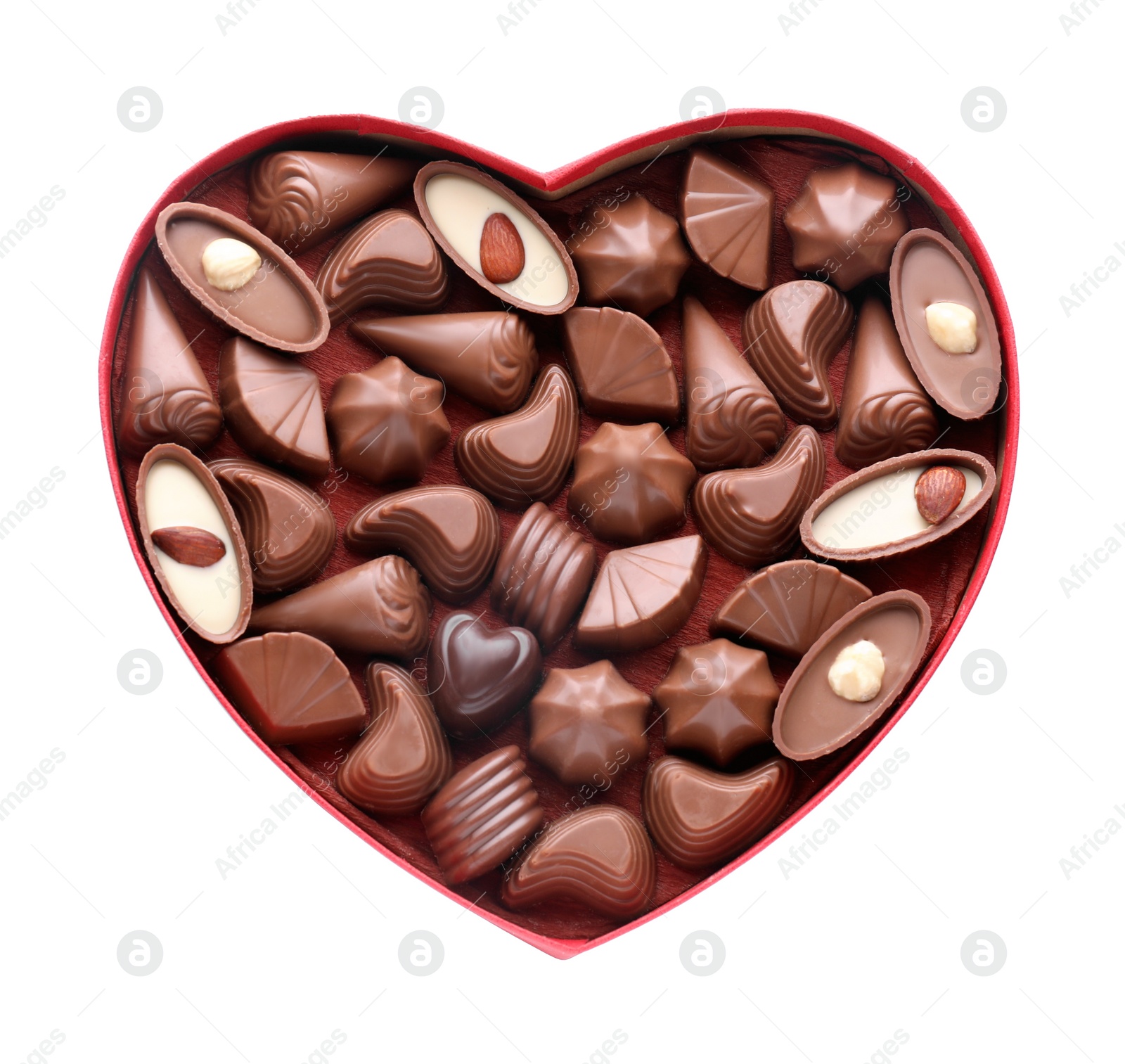 Photo of Heart shaped box with delicious chocolate candies on white background, top view