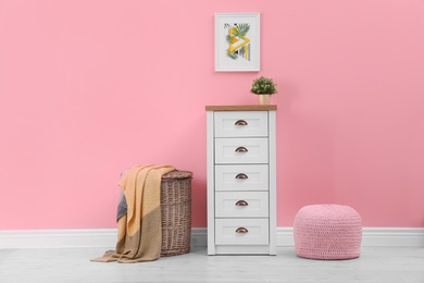 Photo of Chest of drawers in stylish living room interior