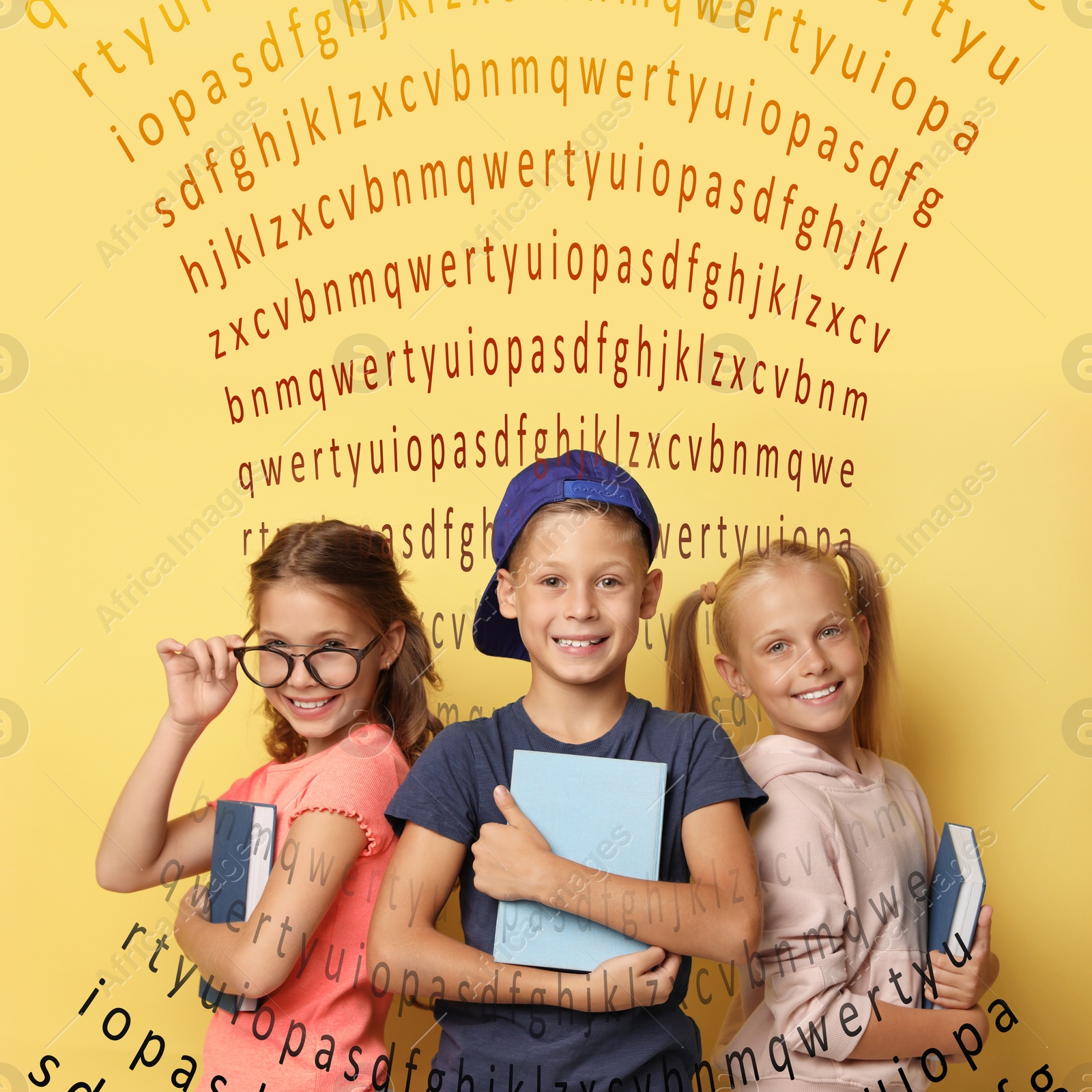 Image of Group of little children reading books on yellow background