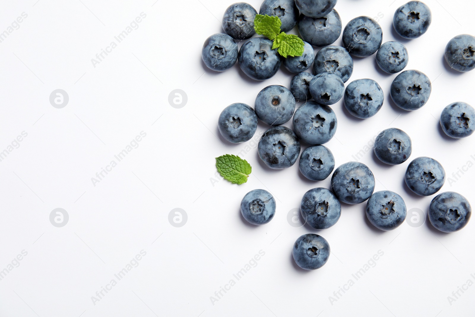 Photo of Flat lay composition with tasty blueberry and space for text on white background