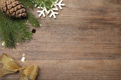 Flat lay composition with festive decor on wooden background, space for text. Happy New Year