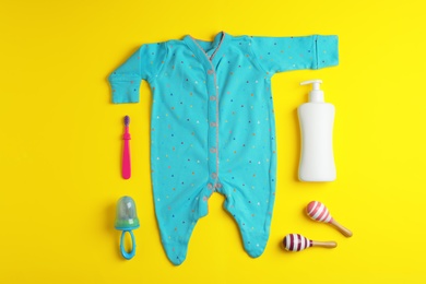 Photo of Flat lay composition with baby accessories on color background