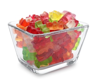 Glass bowl with delicious jelly bears on white background