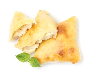 Photo of Delicious samosas and basil isolated on white, top view. Homemade pastry