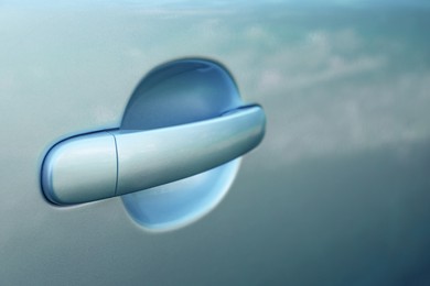 Photo of Closeup view of car door with handle