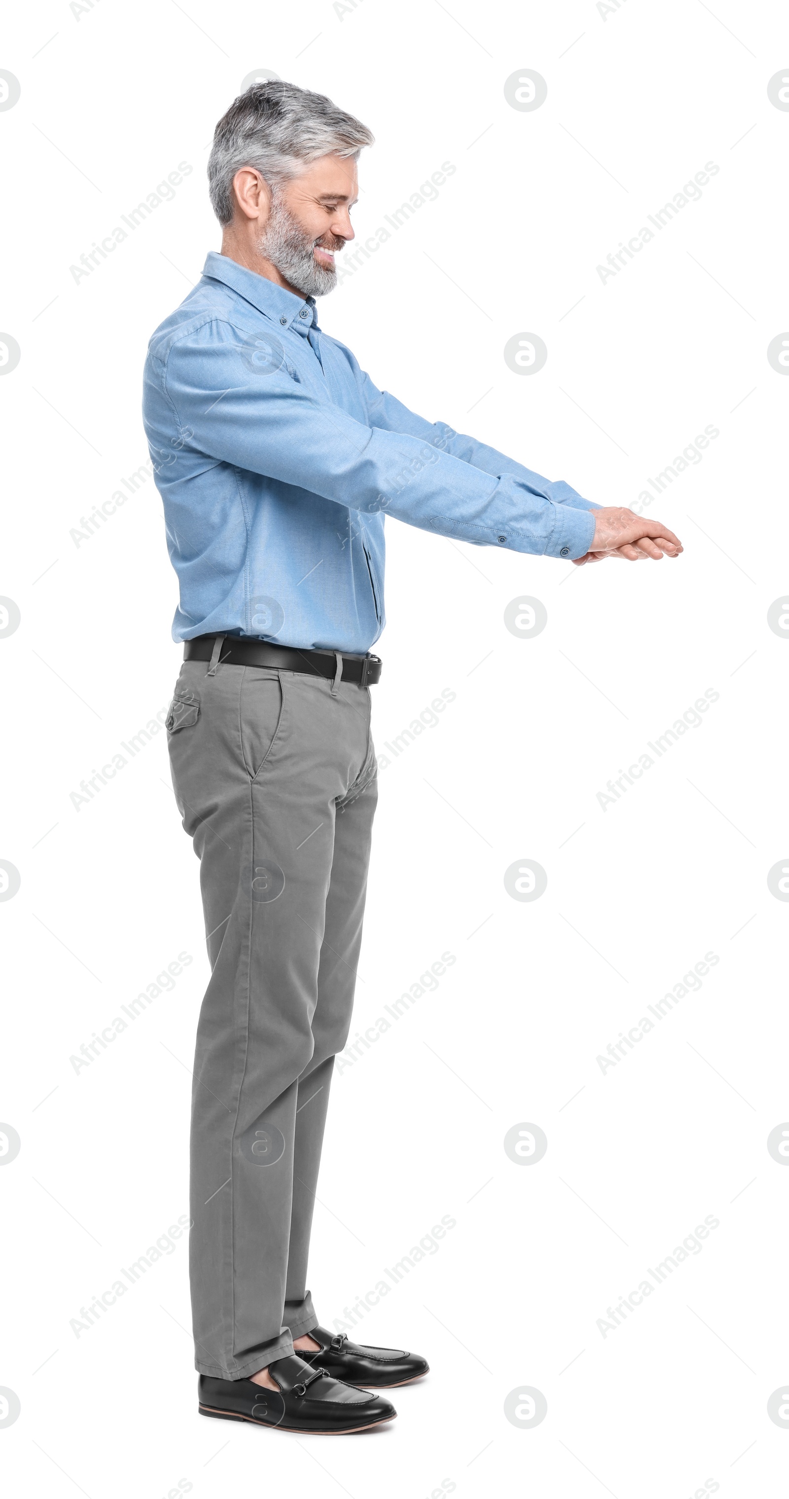 Photo of Mature businessman in stylish clothes posing on white background