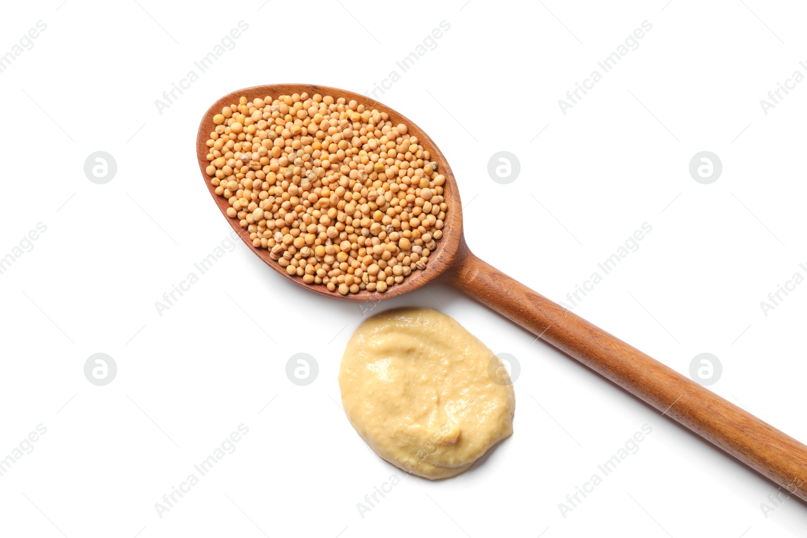 Photo of Mustard and wooden spoon with seeds on white background, top view