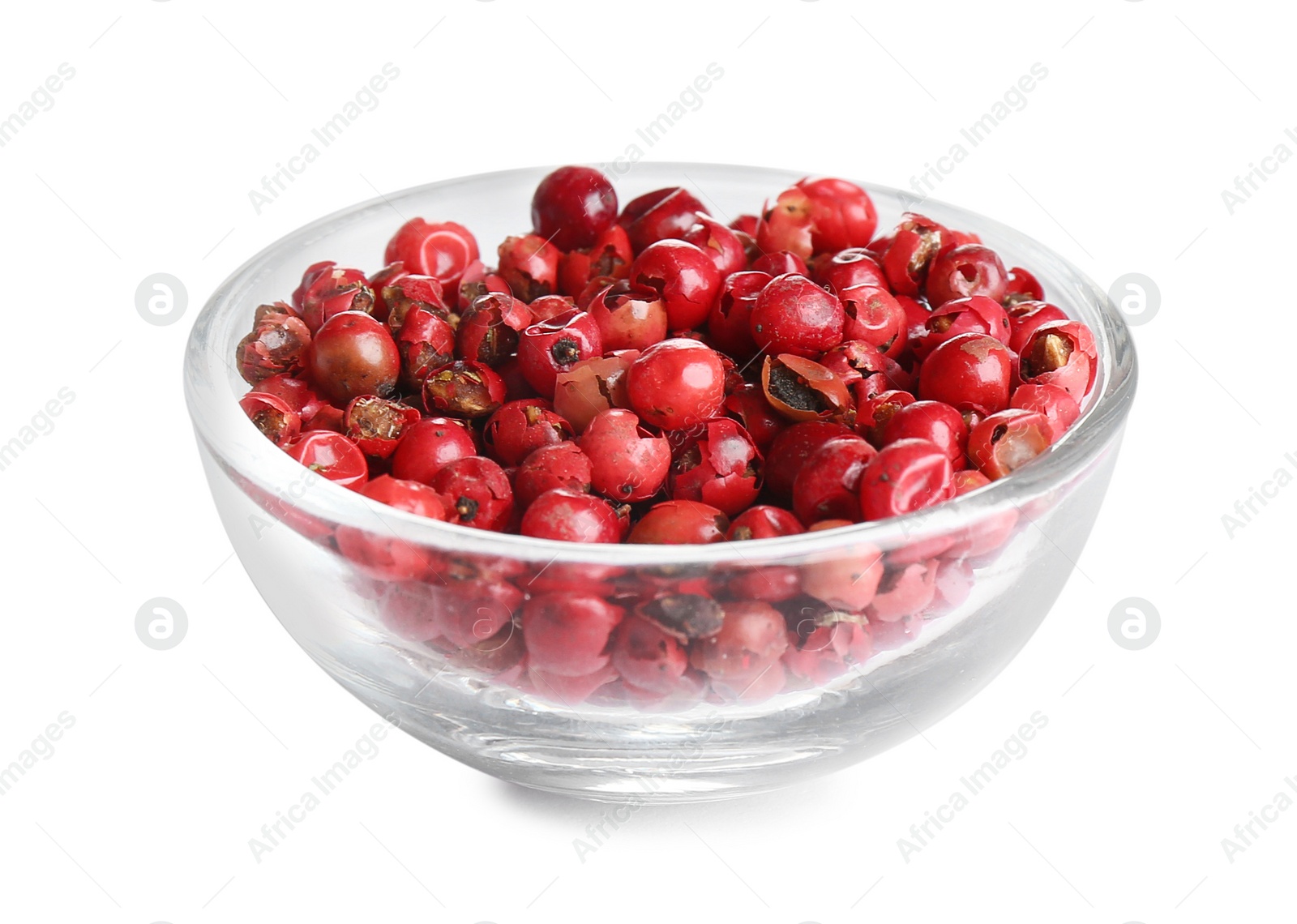 Photo of Bowl of red peppercorns isolated on white