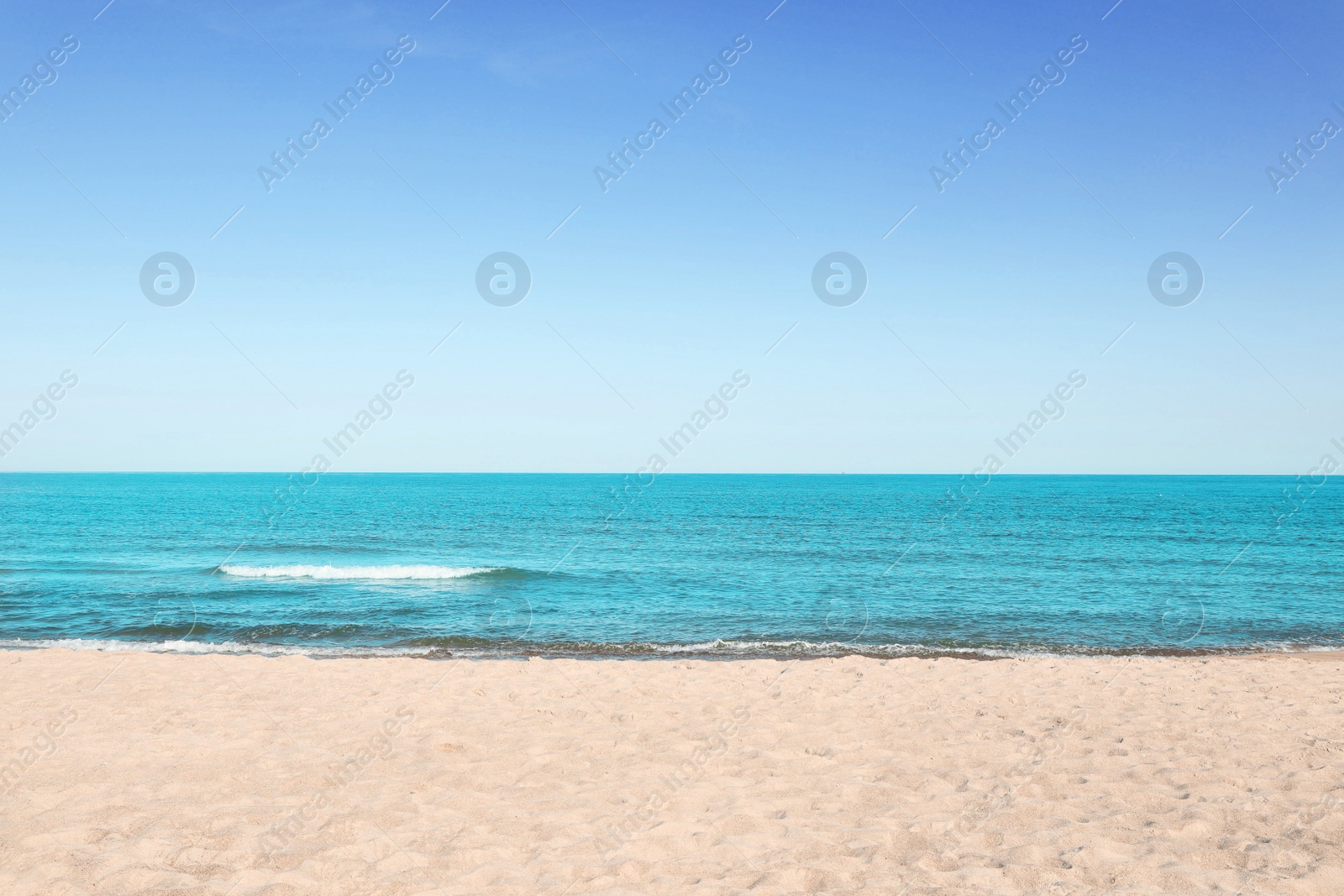 Photo of Picturesque view of sandy beach near sea