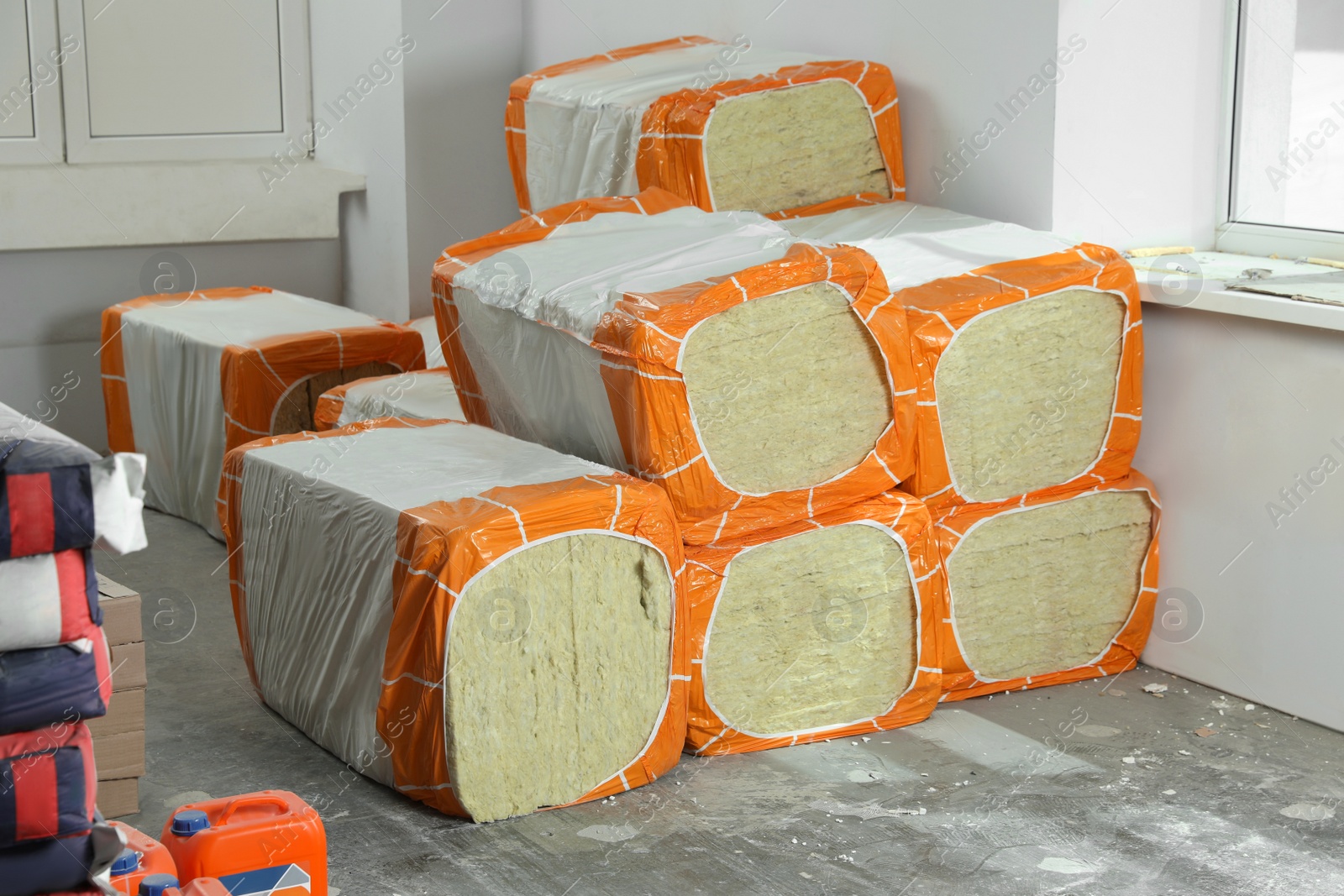Photo of Stacked packages of thermal insulation material in room