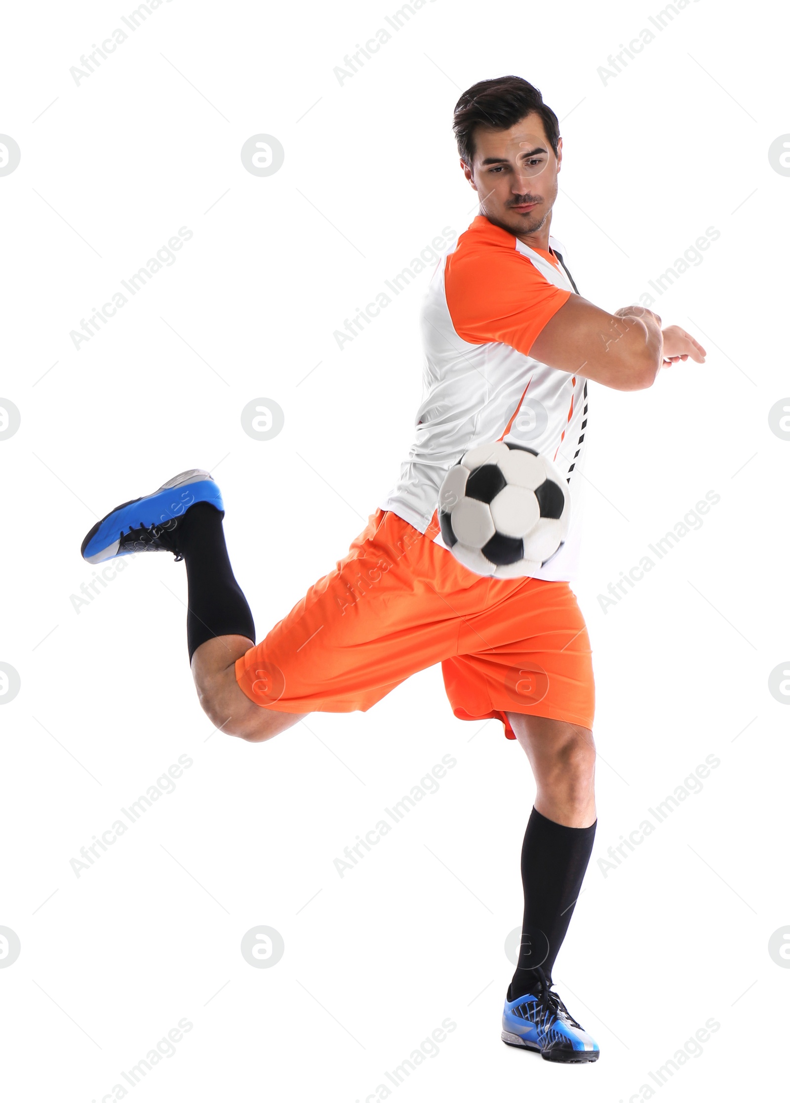 Photo of Young man playing football on white background