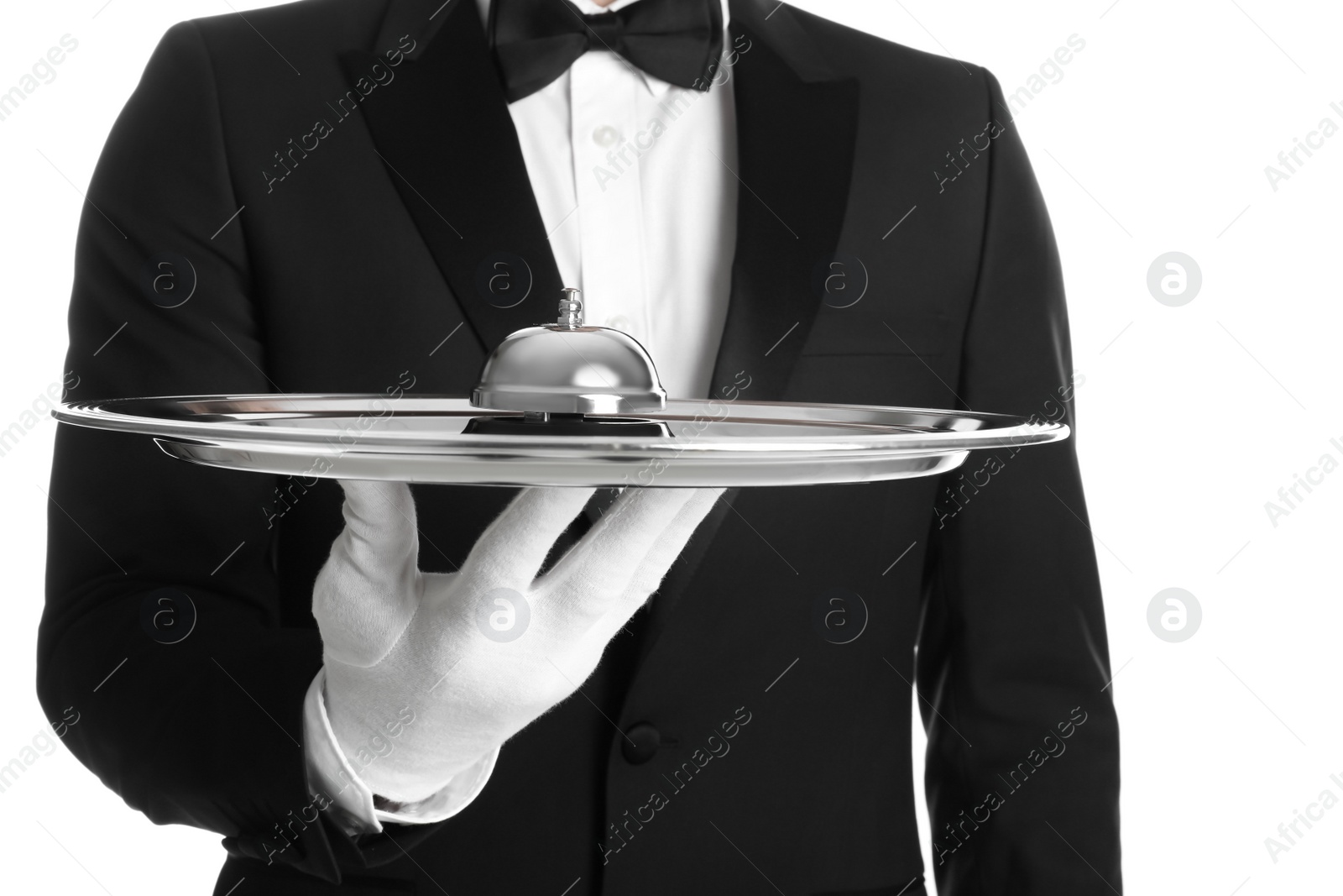 Photo of Butler holding metal tray with service bell on white background, closeup