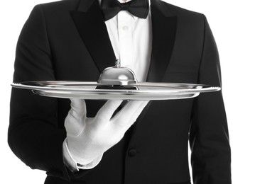 Butler holding metal tray with service bell on white background, closeup