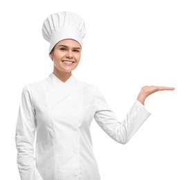 Happy female chef wearing uniform and cap on white background