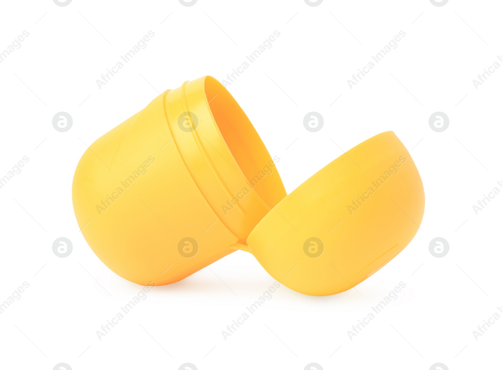 Photo of Slynchev Bryag, Bulgaria - May 23, 2023: Opened yellow plastic capsule from Kinder Surprise Egg isolated on white