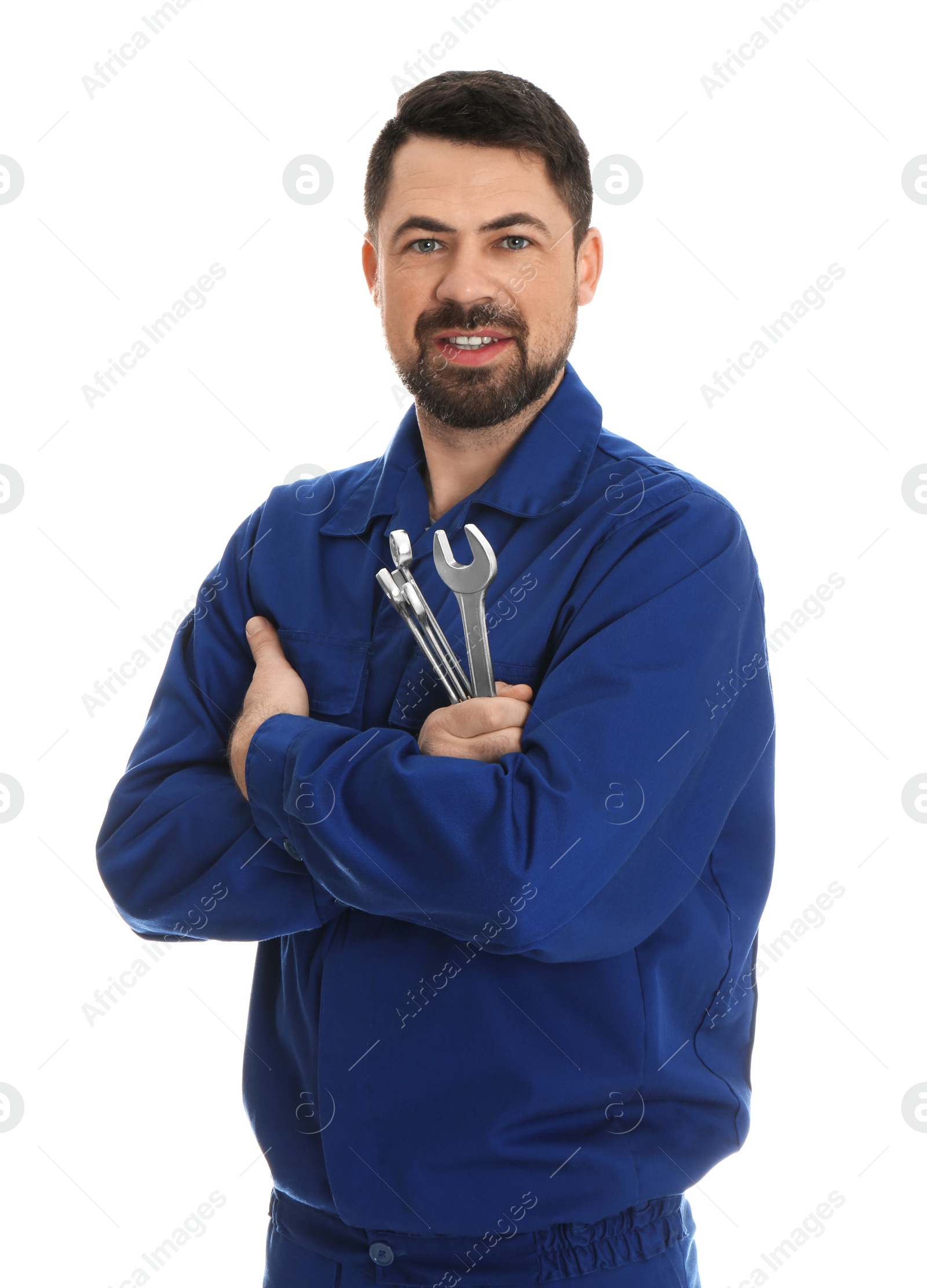 Photo of Portrait of professional auto mechanic with wrenches on white background