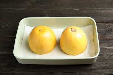 Photo of Raw cut spaghetti squash in baking dish on table